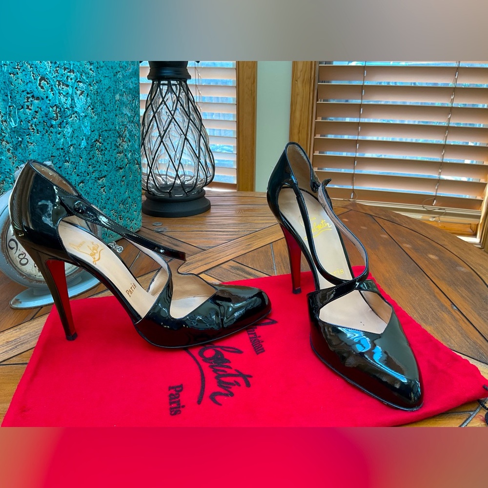 Christian Louboutin black patent heels.